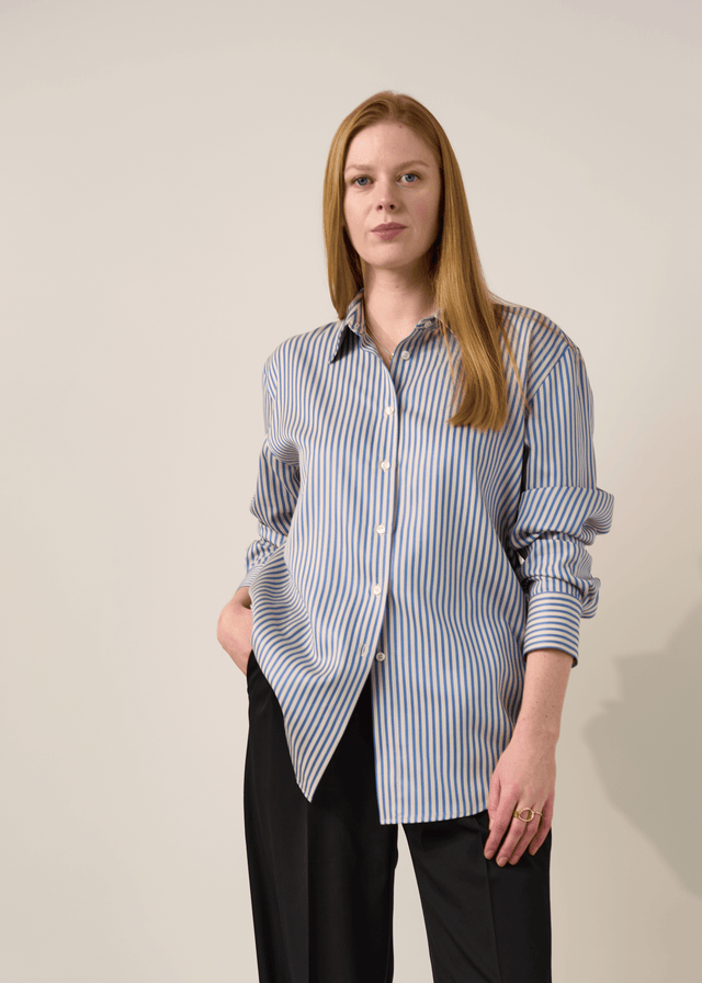 Blue striped button-up shirt made for tall women with wrinkle-resistant fabric